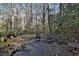 Backyard patio area with mature trees and privacy at 337 Andrew Bailey Rd, Sharpsburg, GA 30277
