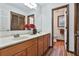 Bathroom featuring double vanity, and a doorway leading to the toilet at 337 Andrew Bailey Rd, Sharpsburg, GA 30277