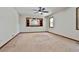 Expansive bedroom with a ceiling fan and large windows providing ample natural light at 337 Andrew Bailey Rd, Sharpsburg, GA 30277