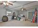 View of carpeted bedroom with window AC unit used as storage space at 337 Andrew Bailey Rd, Sharpsburg, GA 30277