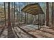 Covered carport offering sheltered parking and protection for vehicles, nestled among trees at 337 Andrew Bailey Rd, Sharpsburg, GA 30277