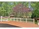 Spacious deck overlooking lush backyard with mature trees, beautiful landscaping, and gazebo at 337 Andrew Bailey Rd, Sharpsburg, GA 30277