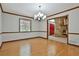 Formal dining room with hardwood floors and chandelier lighting at 337 Andrew Bailey Rd, Sharpsburg, GA 30277