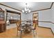 Elegant dining room with hardwood floors, chandelier, and decorative wood trim at 337 Andrew Bailey Rd, Sharpsburg, GA 30277