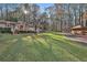 Charming exterior view with a large grassy yard, gazebo, and inviting front porch at 337 Andrew Bailey Rd, Sharpsburg, GA 30277