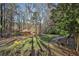 Beautiful view of a property featuring a yard, gazebo, and surrounding trees at 337 Andrew Bailey Rd, Sharpsburg, GA 30277