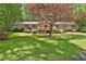 Well-maintained single-story home with a spacious front lawn, red shutters, and inviting porch at 337 Andrew Bailey Rd, Sharpsburg, GA 30277