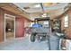 View of garage containing a UTV, bicycles, and storage, leading into an interior room at 337 Andrew Bailey Rd, Sharpsburg, GA 30277