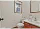 Cozy half bathroom featuring a white toilet, sink, and traditional accents at 337 Andrew Bailey Rd, Sharpsburg, GA 30277