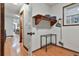 Hallway with hardwood floors and a storage area featuring shelves and a window bringing in natural light at 337 Andrew Bailey Rd, Sharpsburg, GA 30277