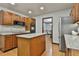 Kitchen features wood cabinets, granite countertops, stainless steel appliances, and an island at 337 Andrew Bailey Rd, Sharpsburg, GA 30277