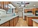 Charming kitchen with wood cabinets, granite countertops, and modern appliances at 337 Andrew Bailey Rd, Sharpsburg, GA 30277