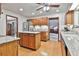Bright and airy kitchen featuring granite countertops, wood cabinets, and stainless appliances at 337 Andrew Bailey Rd, Sharpsburg, GA 30277
