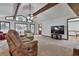 Bright living room featuring vaulted ceilings and a view of wooded backyard at 337 Andrew Bailey Rd, Sharpsburg, GA 30277
