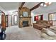 Bright living room featuring a stone fireplace and hardwood ceiling beams at 337 Andrew Bailey Rd, Sharpsburg, GA 30277