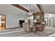 Spacious living room featuring beamed ceilings and a stone fireplace at 337 Andrew Bailey Rd, Sharpsburg, GA 30277