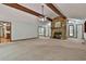 Expansive living room featuring a stone fireplace and ample natural light at 337 Andrew Bailey Rd, Sharpsburg, GA 30277
