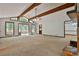 Bright living room with exposed beams, fireplace, and comfortable seating at 337 Andrew Bailey Rd, Sharpsburg, GA 30277