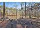 The pond with outdoor entertainment space and a dock create a serene lakeside retreat at 337 Andrew Bailey Rd, Sharpsburg, GA 30277