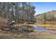 Relaxing view of lake with mature trees surrounding the shoreline at 337 Andrew Bailey Rd, Sharpsburg, GA 30277