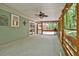 Relaxing screened porch with forest views, ceiling fan and access to an outdoor deck at 337 Andrew Bailey Rd, Sharpsburg, GA 30277
