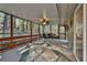 Enjoy the screened porch with ceiling fan, furniture and scenic views at 337 Andrew Bailey Rd, Sharpsburg, GA 30277