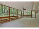 Screened porch with ceiling fan offers scenic views of the surrounding woods at 337 Andrew Bailey Rd, Sharpsburg, GA 30277