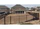 Large fenced backyard featuring a screened-in porch, ideal for entertaining and relaxation at 3566 Andover Way, Buford, GA 30519