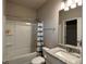 Bathroom featuring shower/tub combo with granite countertop vanity at 3566 Andover Way, Buford, GA 30519