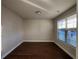 Bright bedroom with hardwood floors and a large window providing ample natural light at 3566 Andover Way, Buford, GA 30519