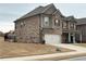 Charming two-story brick home with a two-car garage and well-maintained lawn at 3566 Andover Way, Buford, GA 30519