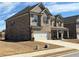 Beautiful two-story brick home with a two-car garage and manicured front lawn at 3566 Andover Way, Buford, GA 30519
