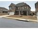 Attractive two-story brick home with a two-car garage and covered front porch at 3566 Andover Way, Buford, GA 30519