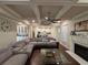 Spacious living room with coffered ceilings, fireplace, and open layout to the kitchen at 3566 Andover Way, Buford, GA 30519