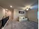 Upstairs loft area with large sectional sofa and fan at 3566 Andover Way, Buford, GA 30519