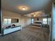 Large main bedroom featuring tray ceilings, carpeted floors, and bedside tables at 3566 Andover Way, Buford, GA 30519