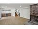 Open basement features a brick fireplace, wet bar, and stairs to the main floor at 3567 Beachhill Dr, Atlanta, GA 30340