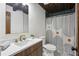 Bathroom featuring modern fixtures, patterned shower curtain, and mosaic tile floors at 3567 Beachhill Dr, Atlanta, GA 30340