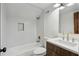 Modern bathroom featuring white tile, sleek vanity, and brushed gold fixtures at 3567 Beachhill Dr, Atlanta, GA 30340