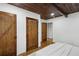 Bedroom with wood ceiling, wood doors, and hardwood floors at 3567 Beachhill Dr, Atlanta, GA 30340