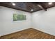 Bedroom with hardwood floors, wood ceiling, and large windows at 3567 Beachhill Dr, Atlanta, GA 30340