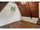 A-frame bedroom with hardwood floors, wood ceiling, and plenty of natural light at 3567 Beachhill Dr, Atlanta, GA 30340