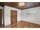 Bedroom with wood ceiling, wood doors, and hardwood floors at 3567 Beachhill Dr, Atlanta, GA 30340