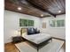 Bedroom with hardwood floors, wood ceiling, and large windows at 3567 Beachhill Dr, Atlanta, GA 30340