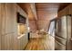 Stylish kitchen featuring wood cabinetry, stainless steel appliances, hardwood floors, and a view to the breakfast nook at 3567 Beachhill Dr, Atlanta, GA 30340