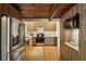 Modern kitchen features sleek wood cabinetry, stainless steel appliances, white countertops, and stylish backsplash at 3567 Beachhill Dr, Atlanta, GA 30340