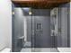 Tile shower with glass doors, gold hardware, and a built-in niche at 3567 Beachhill Dr, Atlanta, GA 30340