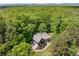 This home is nestled in a lush green area surrounded by a forest with trees as far as the eye can see at 588 Peachtree Se Dr, White, GA 30184