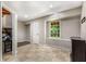 Basement area featuring tile floors, a window, and access to other rooms at 588 Peachtree Se Dr, White, GA 30184