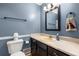 Powder room with a sink, toilet, and neutral-toned walls at 588 Peachtree Se Dr, White, GA 30184